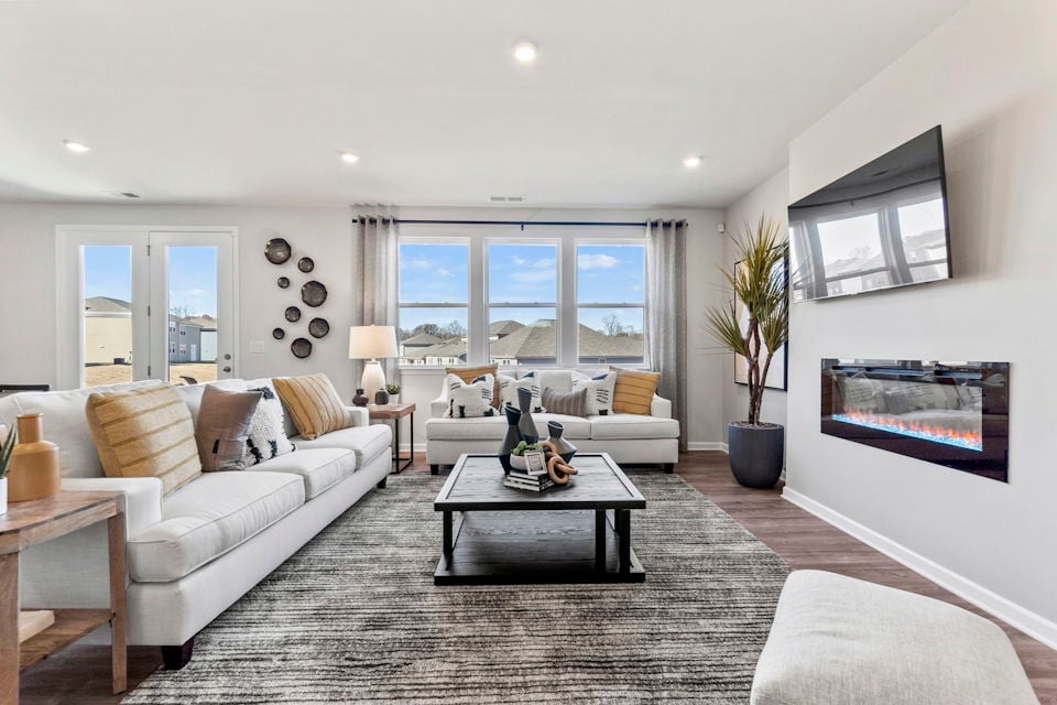 A living room with a large window.