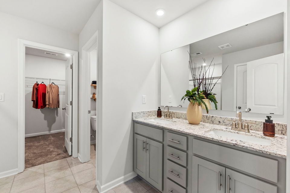 A bathroom with a sink and a shower.