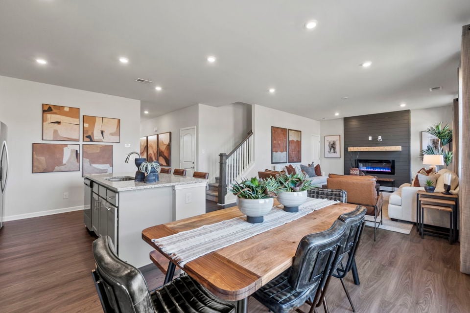 A large kitchen with a dining table.