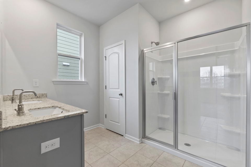 A bathroom with a glass shower.