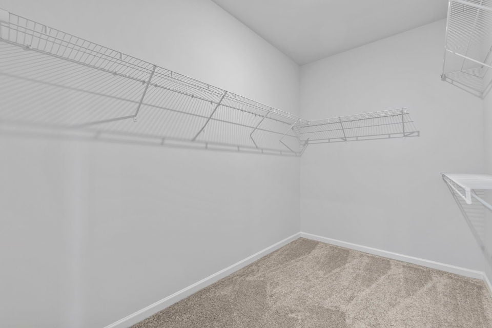 A white room with a tile floor.