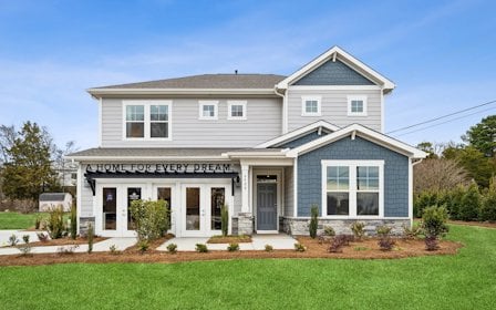 A house with a sign on the front.