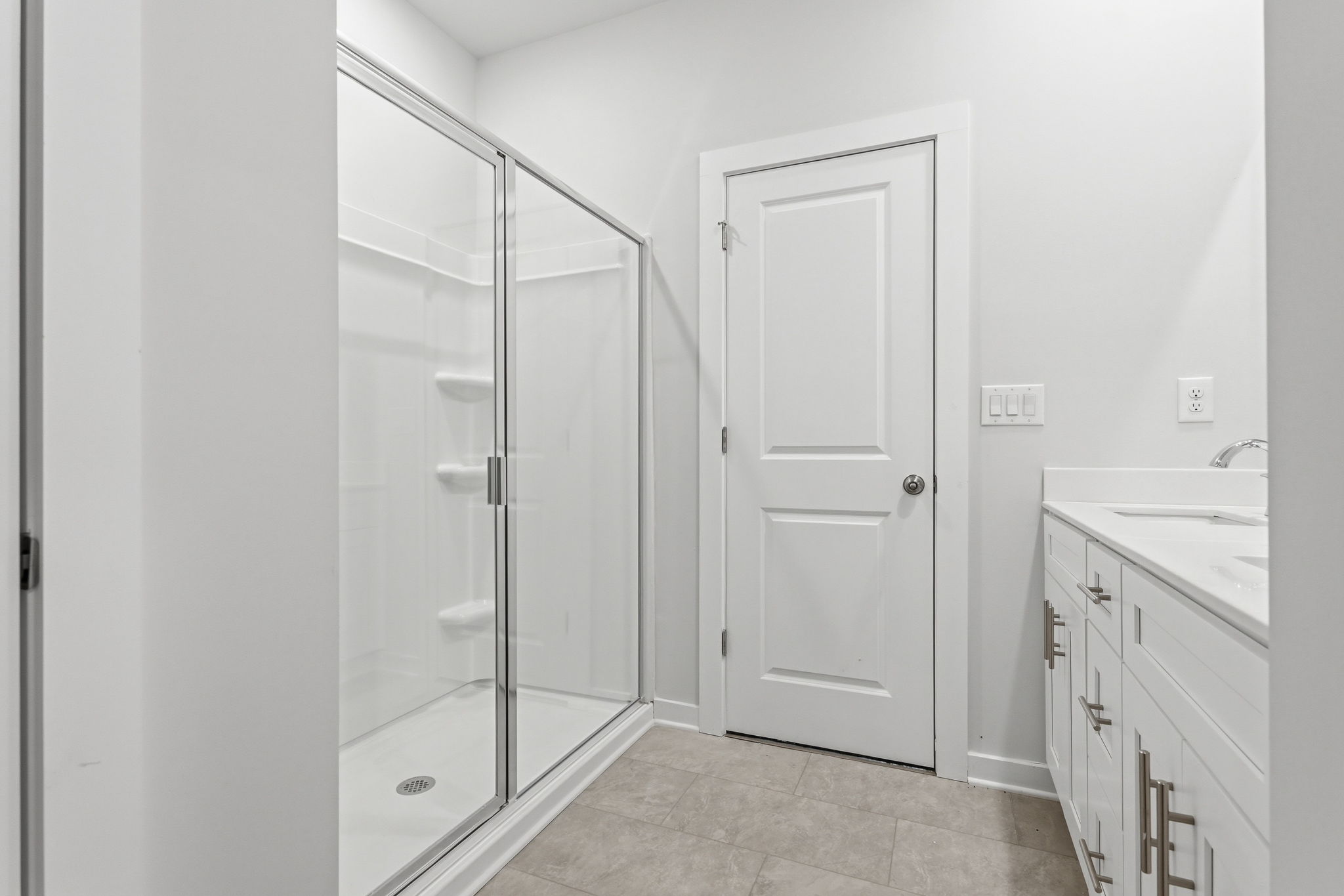 A bathroom with a glass shower.