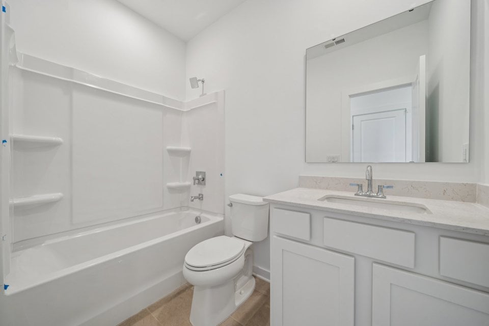 A bathroom with a toilet and sink.