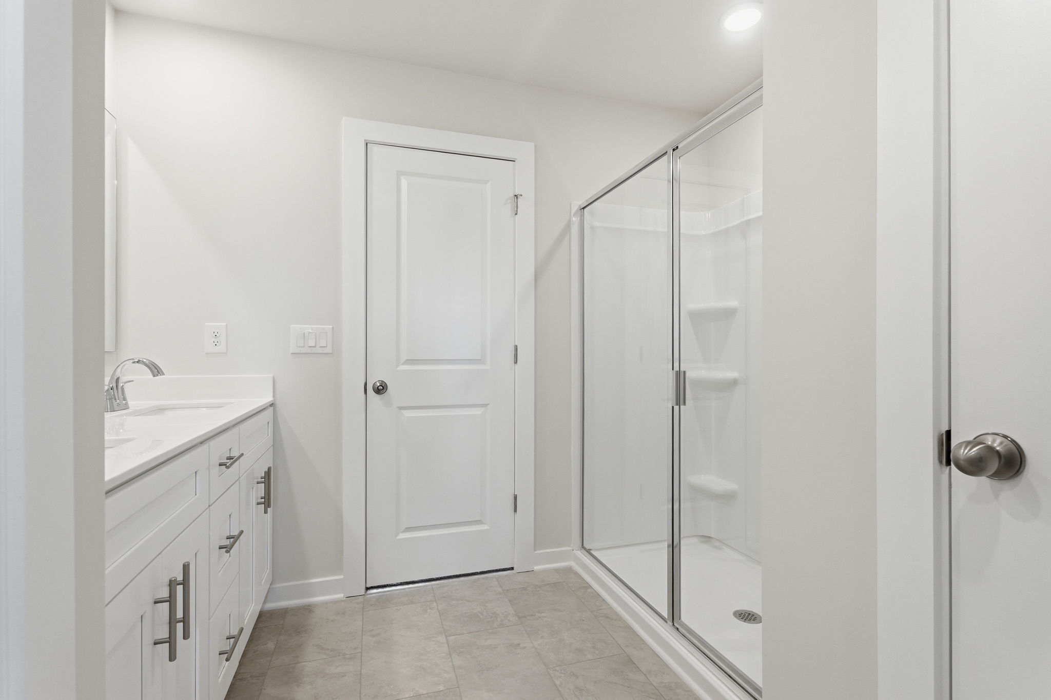 A bathroom with a glass shower.