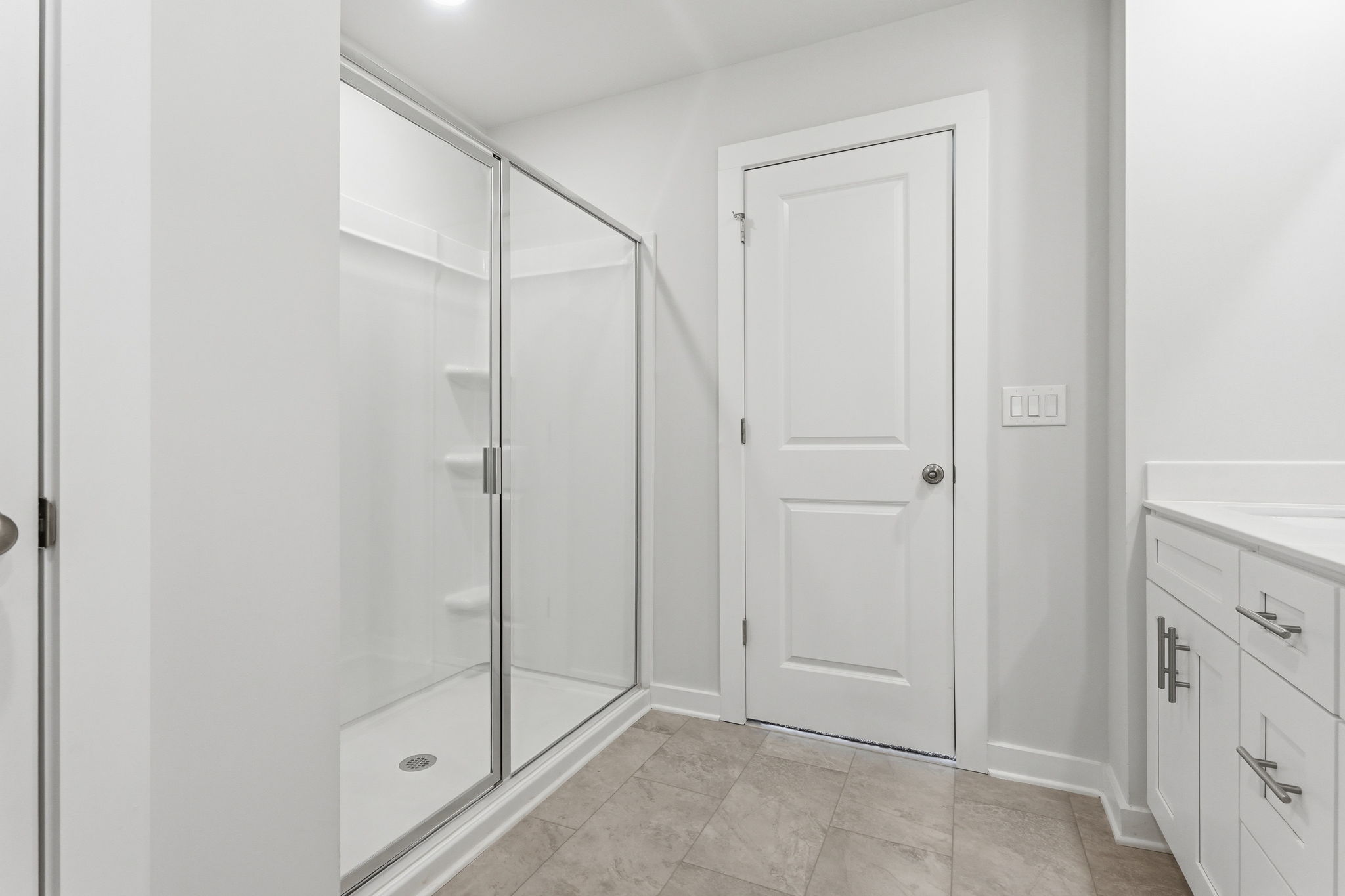 A bathroom with a glass shower.