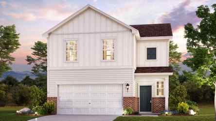 A white house with a driveway.