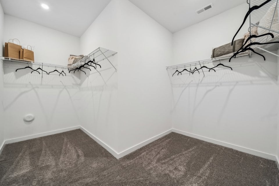 A white room with a staircase.