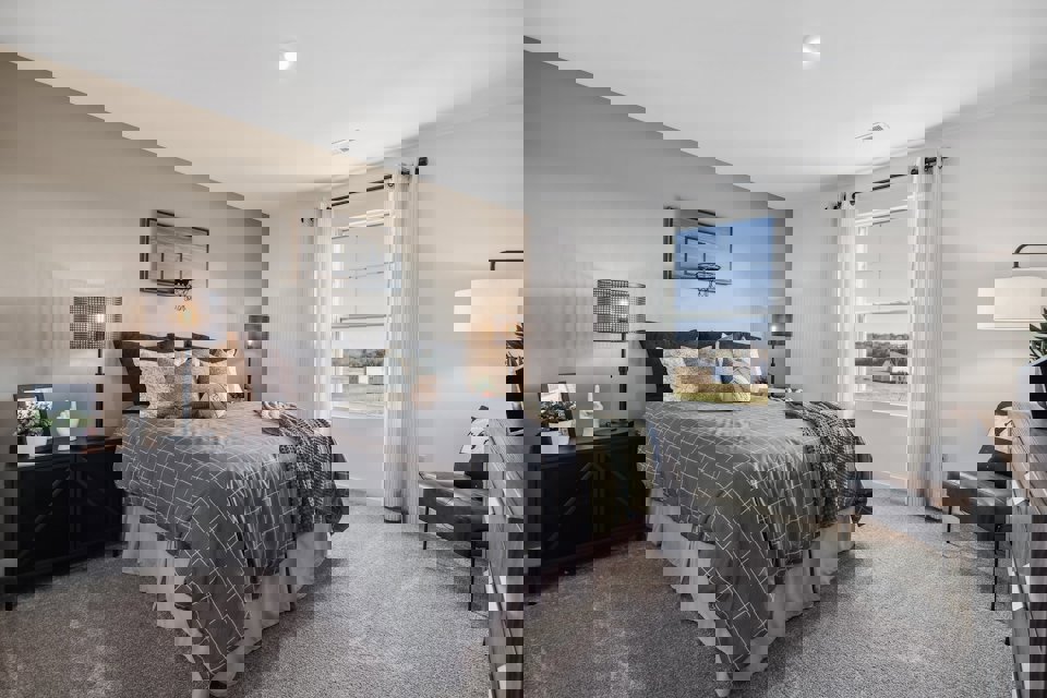 A bedroom with a large bed.