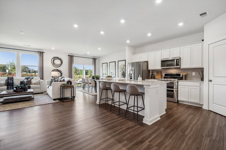 A large kitchen with white cabinets.
