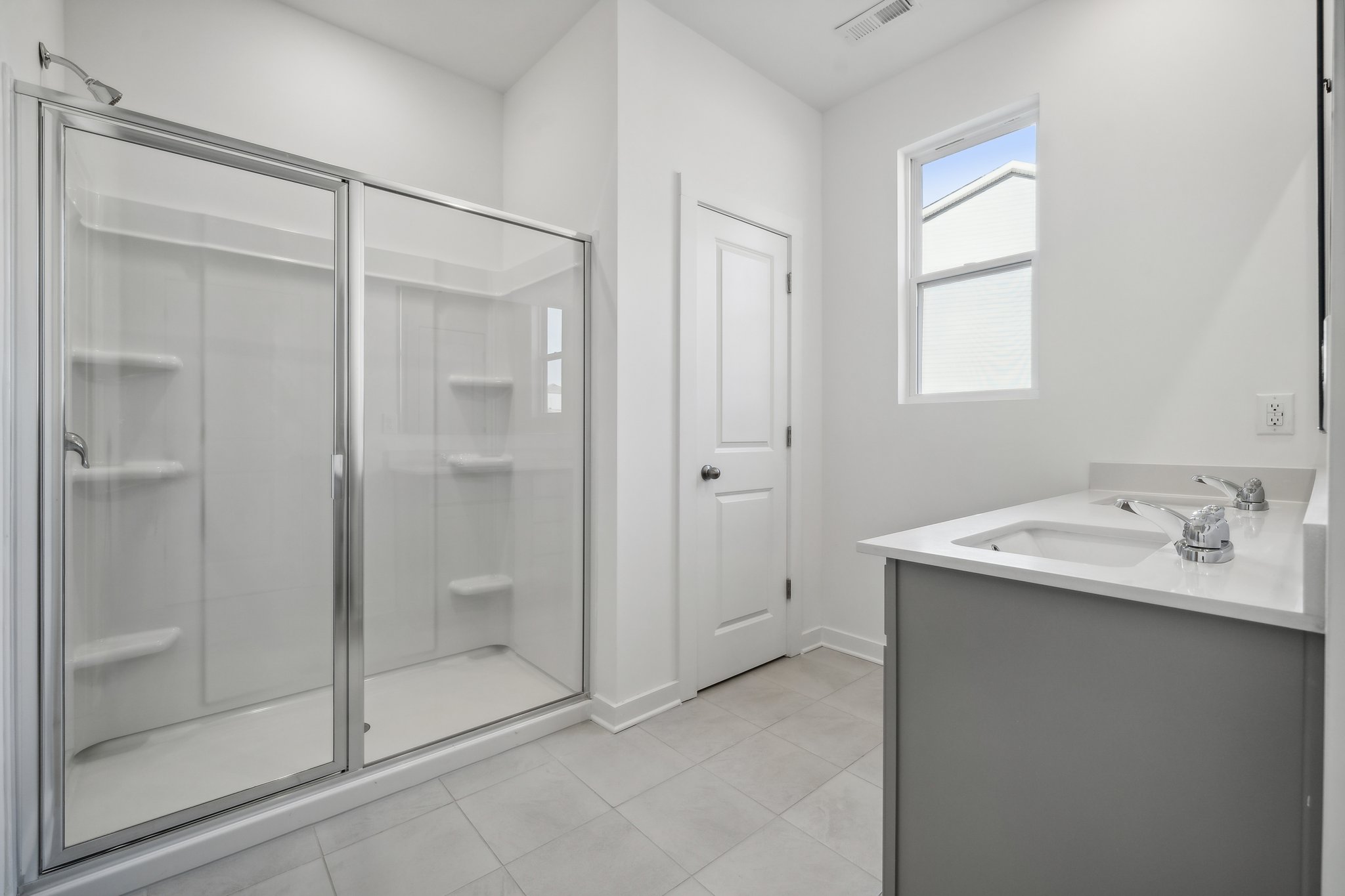 A bathroom with a glass shower.