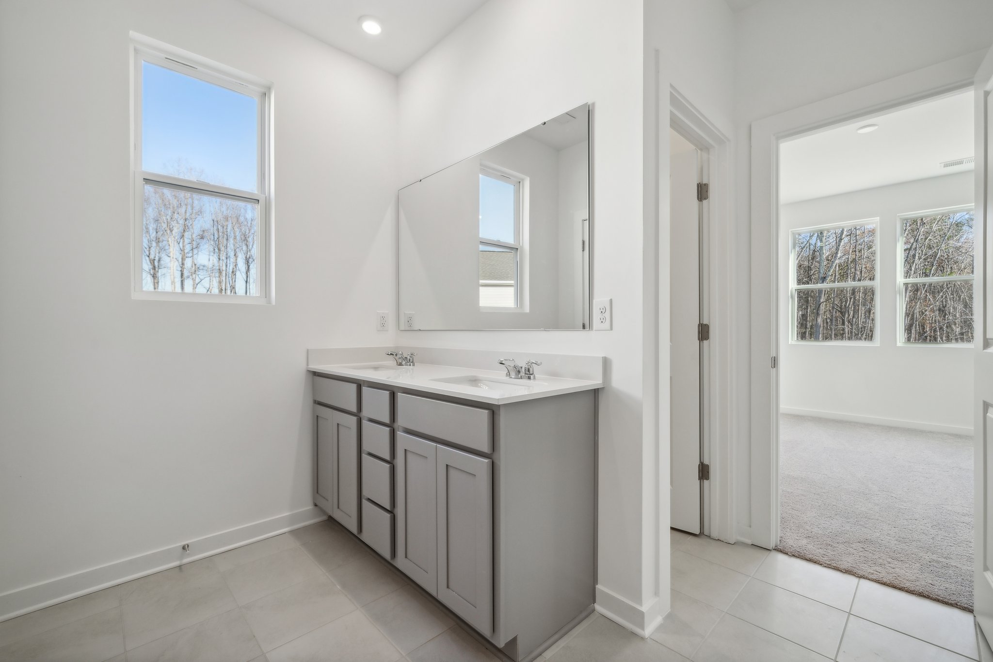 A bathroom with a sink and cabinets.