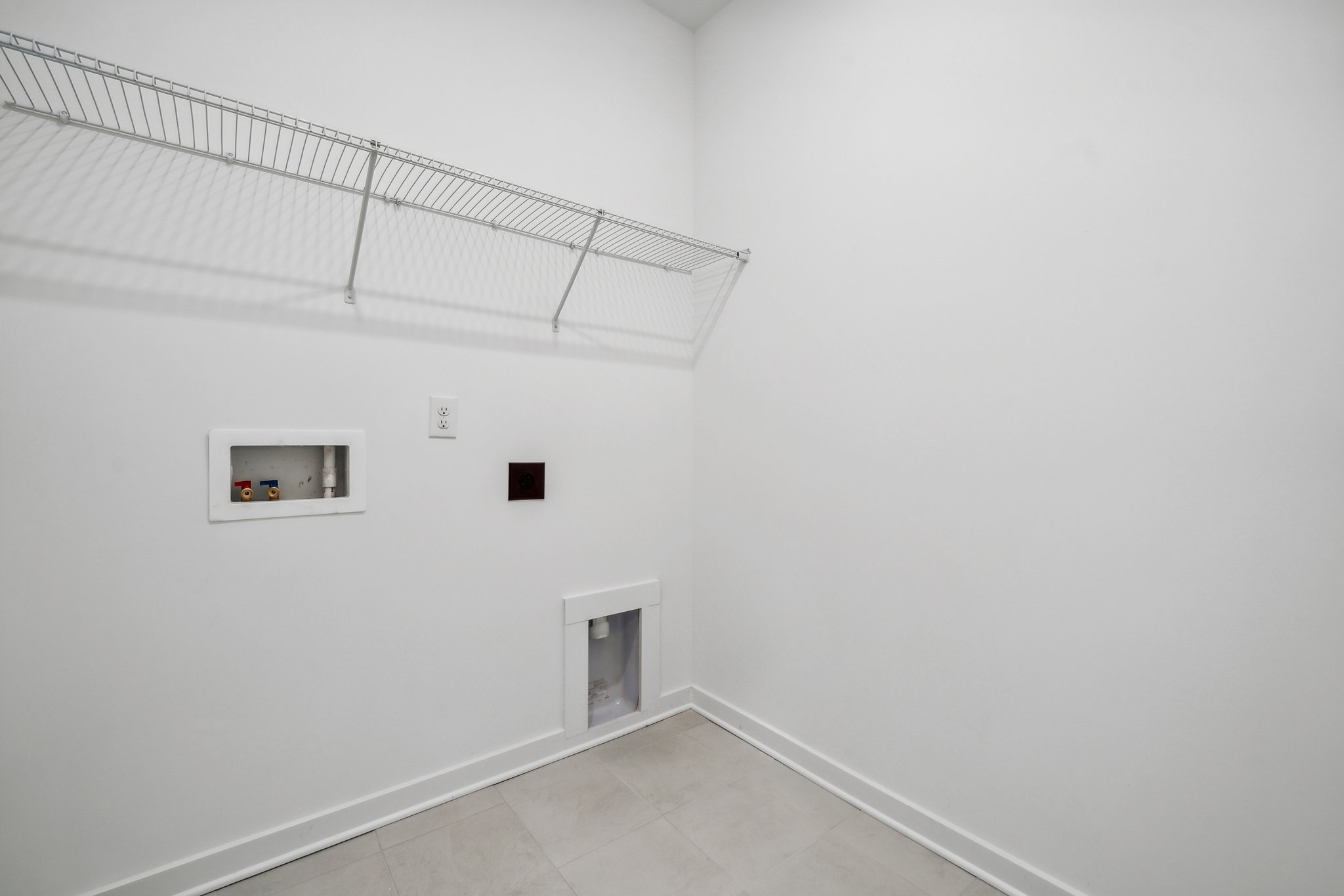 A white hallway with white walls.