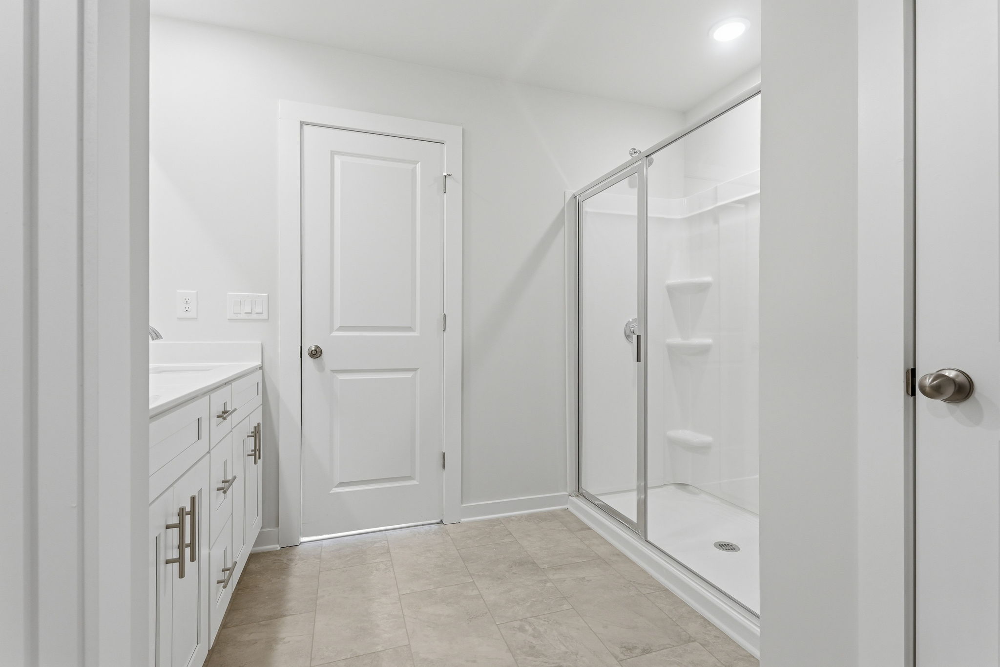 A bathroom with a glass shower.
