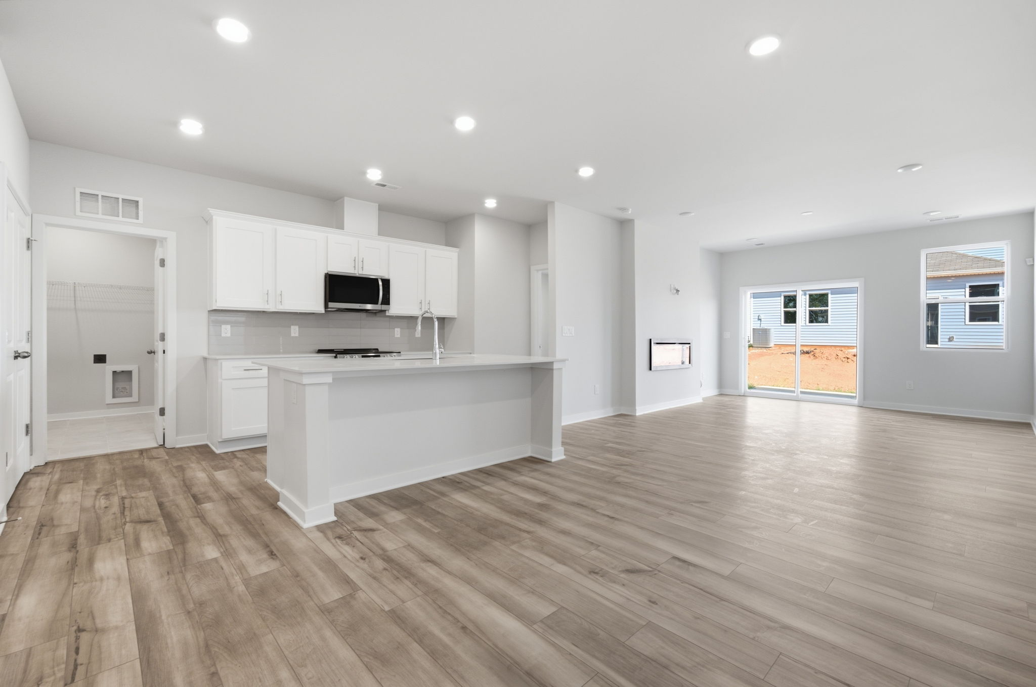 A large kitchen with white cabinets.