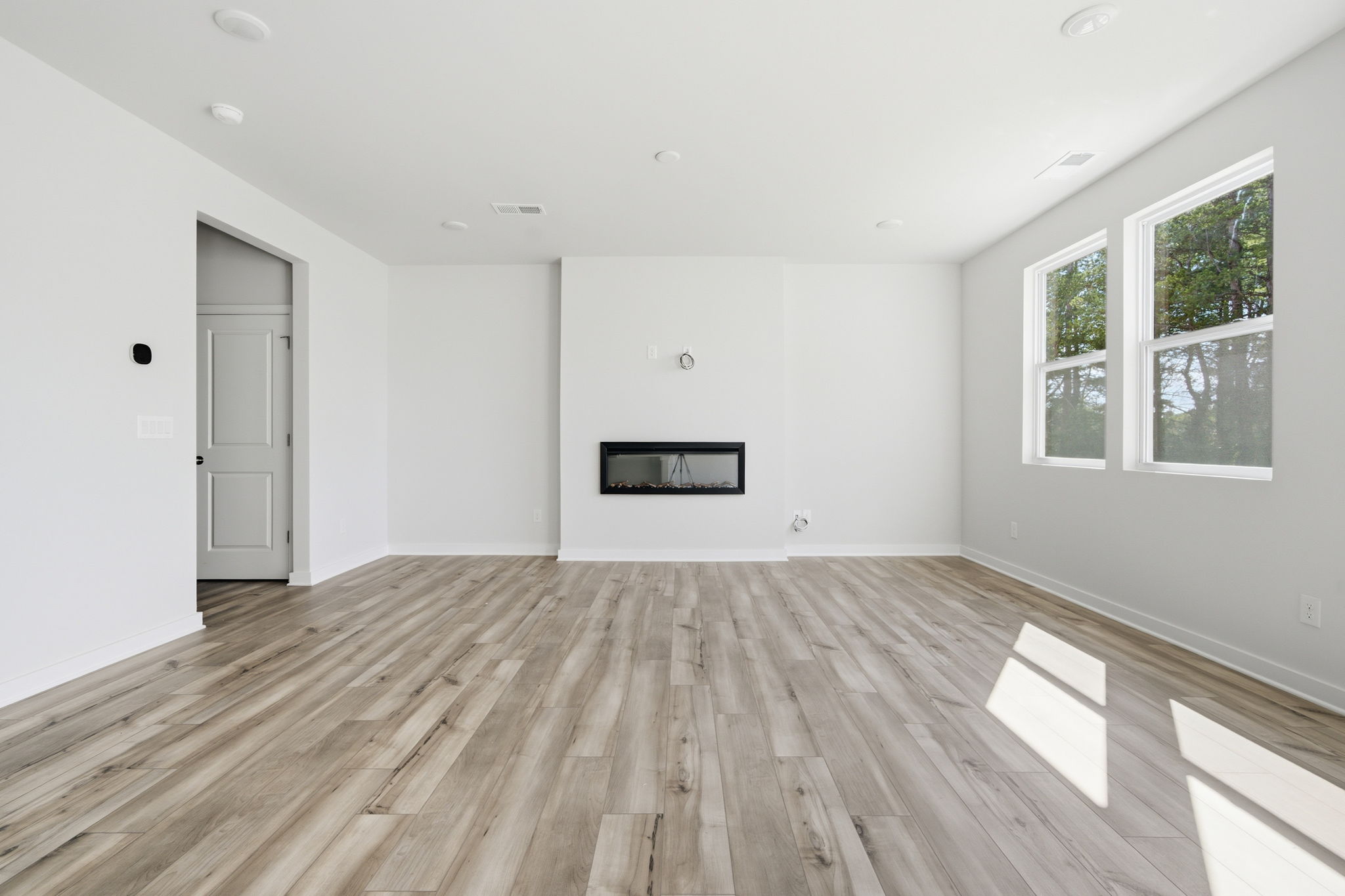 A room with a wood floor and a wood floor.
