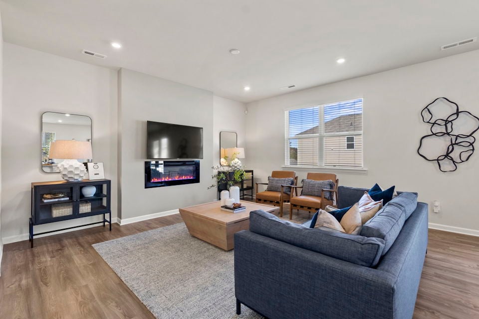 A living room with a couch and a tv.