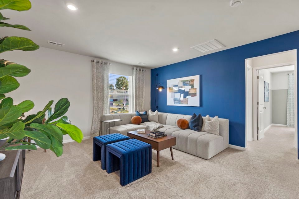 A living room with a couch and a coffee table.