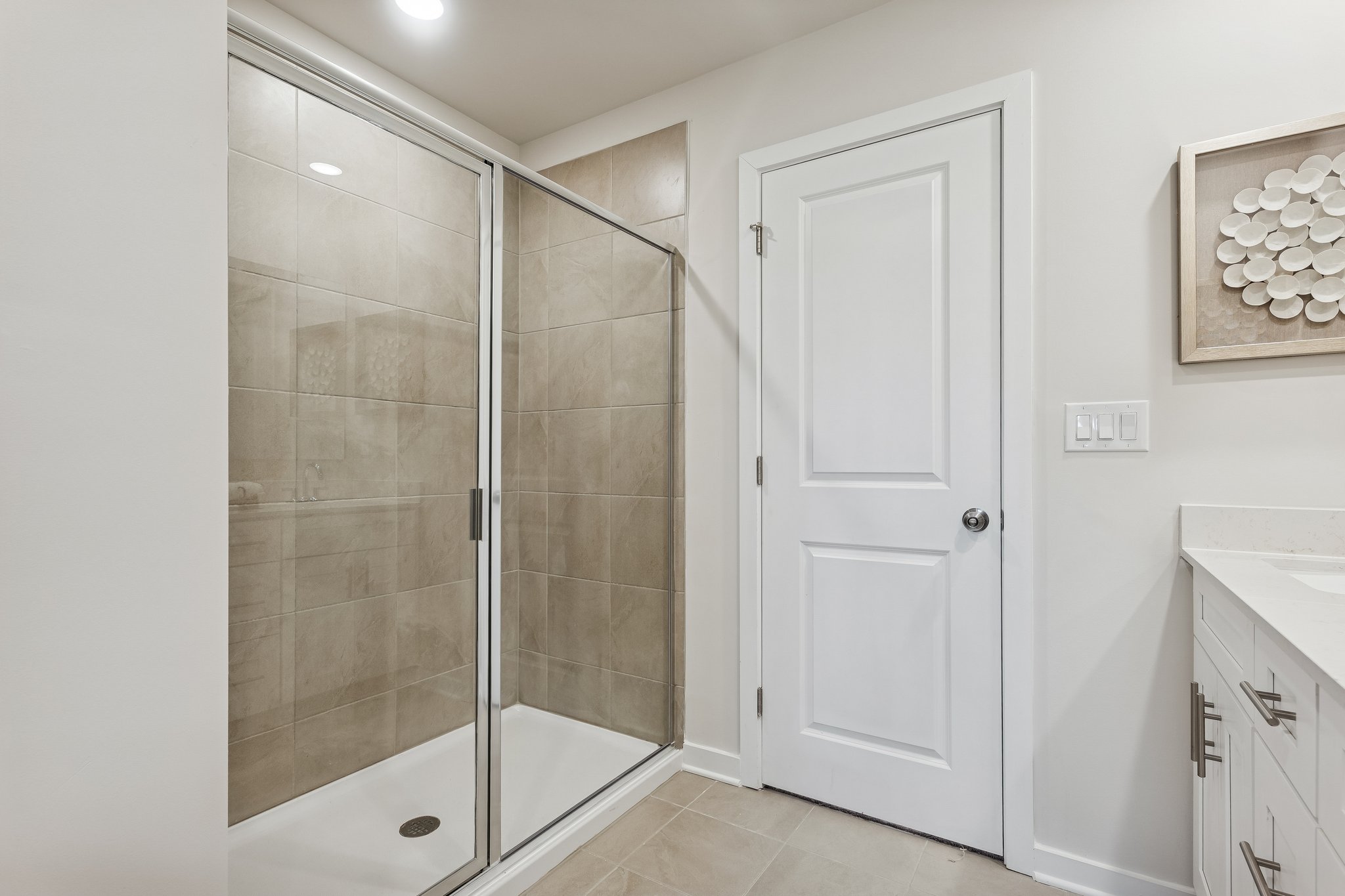 A bathroom with a glass shower.