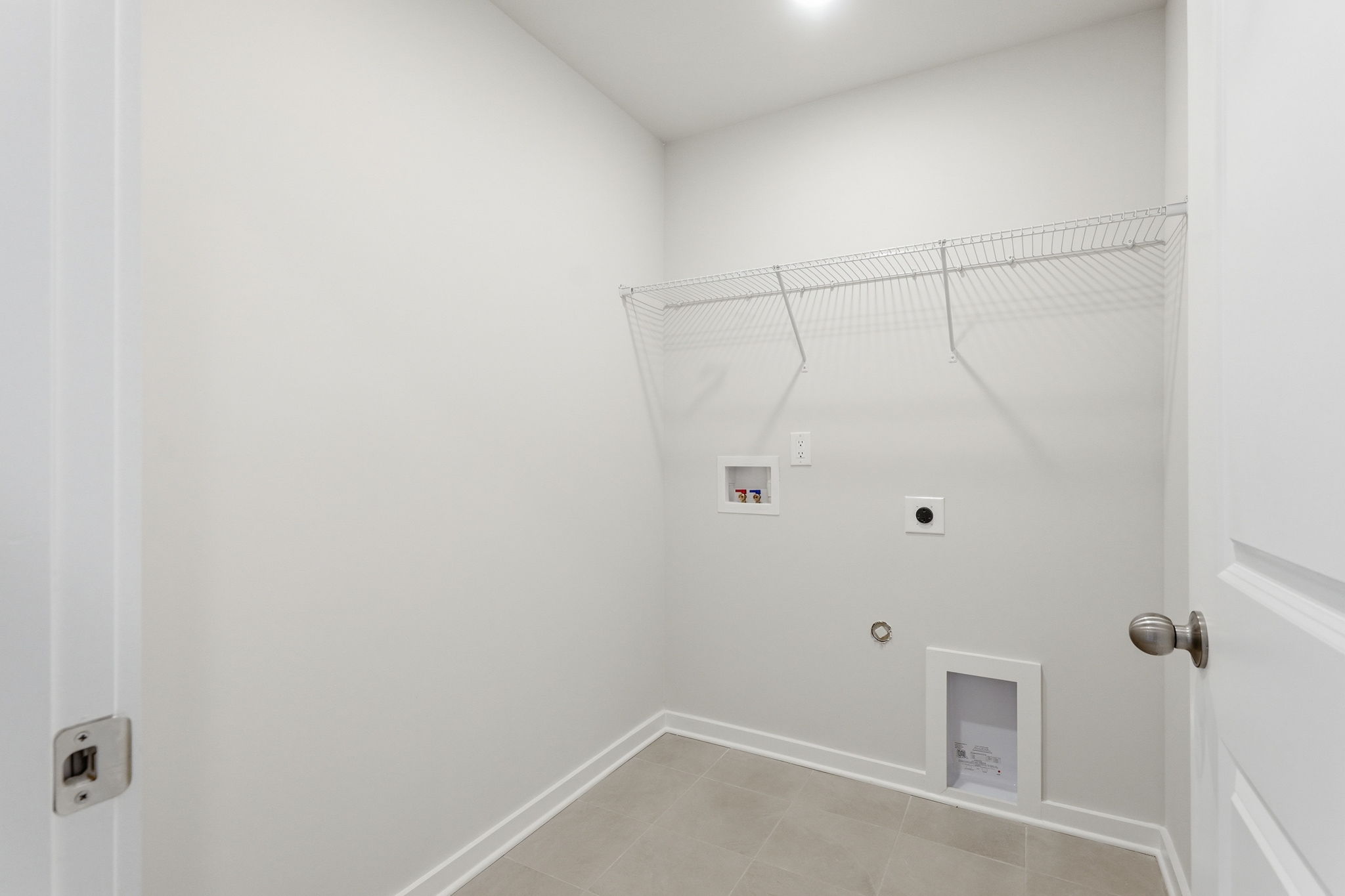 A shower with a tile floor.