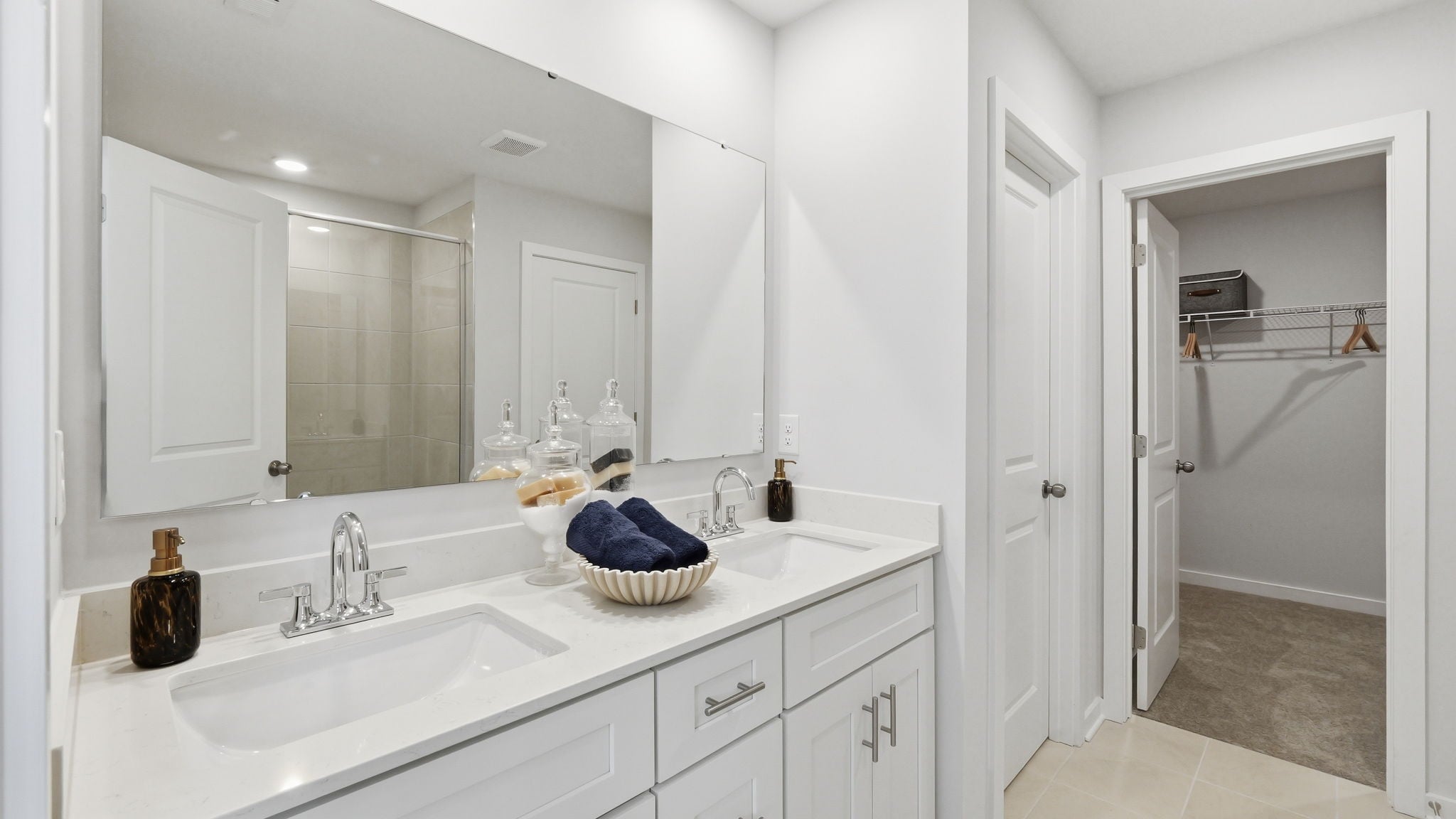 A bathroom with a sink and a shower.