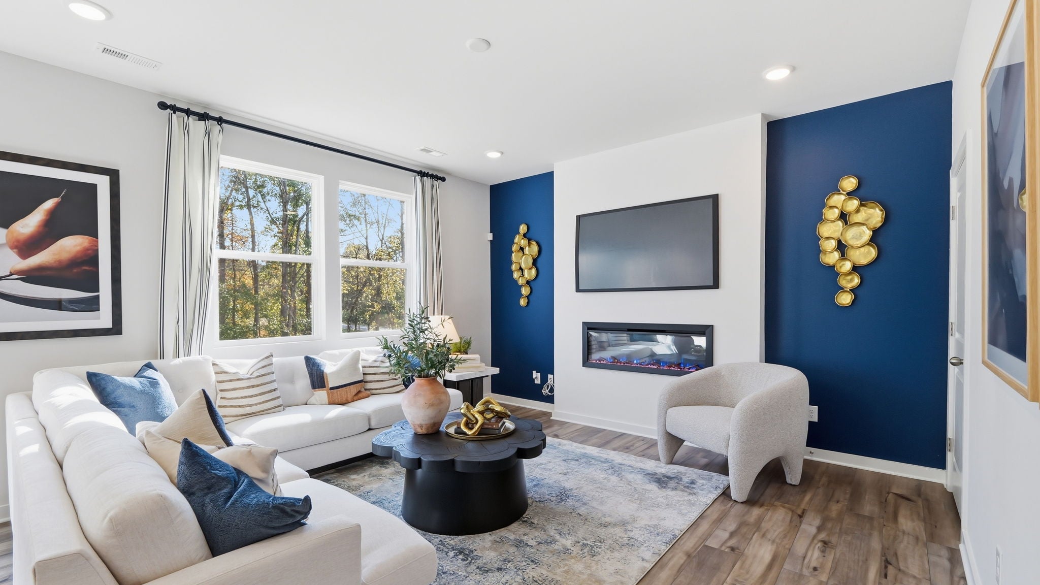 A living room with a blue wall.