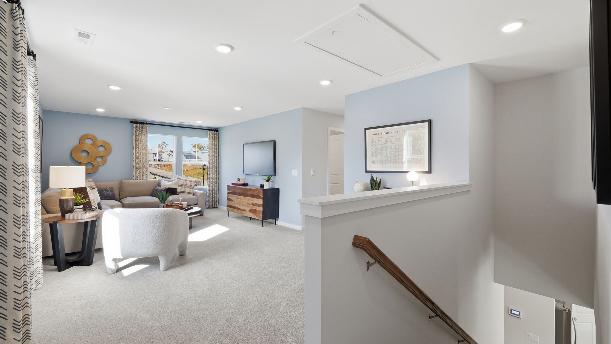 A living room with a staircase.
