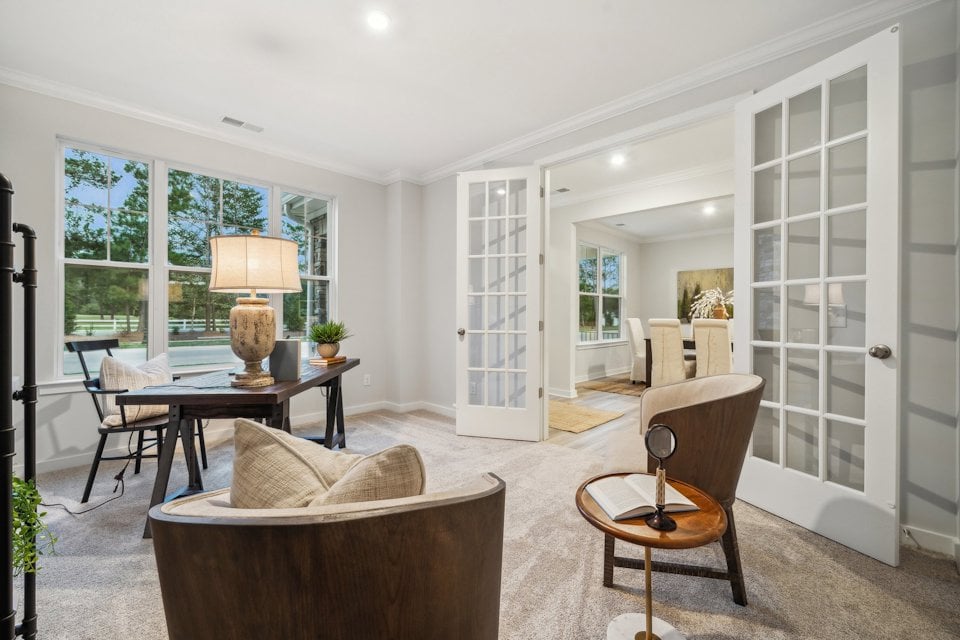 A living room with a large glass door.