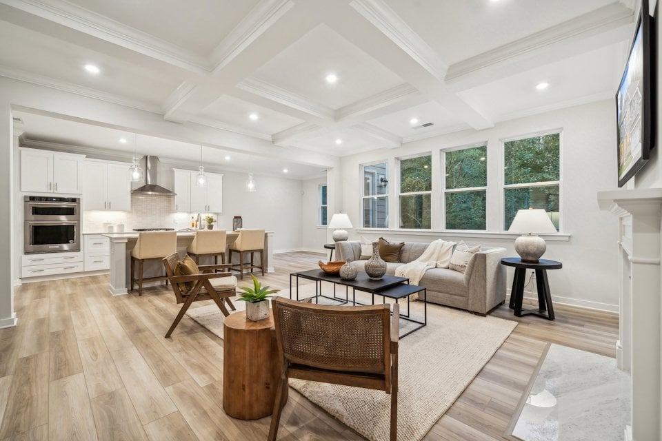 A large living room with a wood floor and a wood floor.