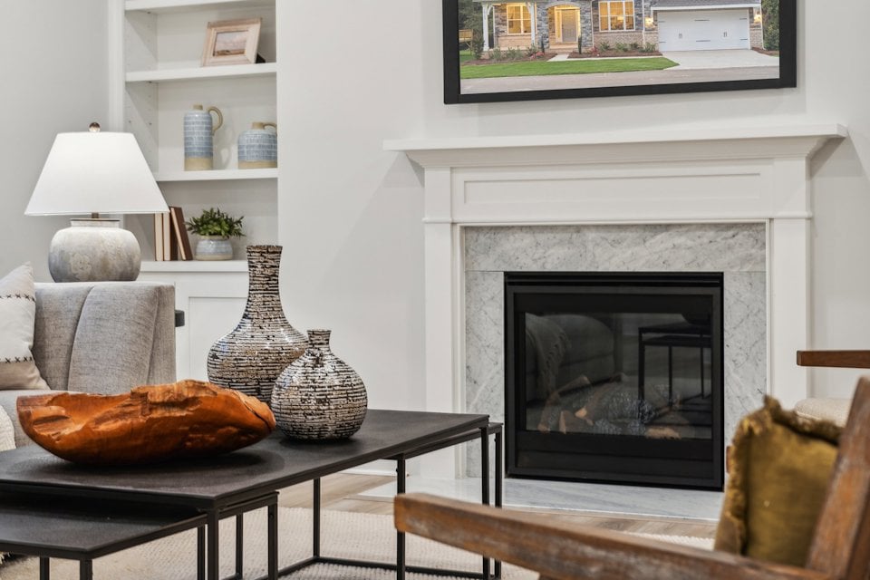 A living room with a fireplace.