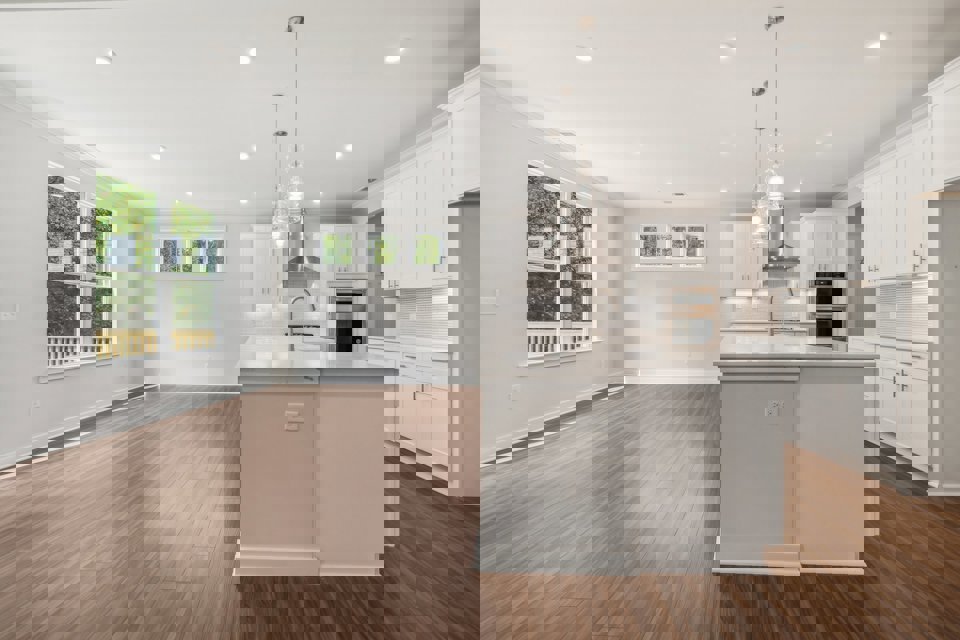 A large kitchen with white cabinets.