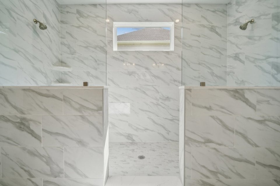 A room with a bed and a window.