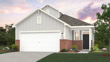 A white house with a garage.