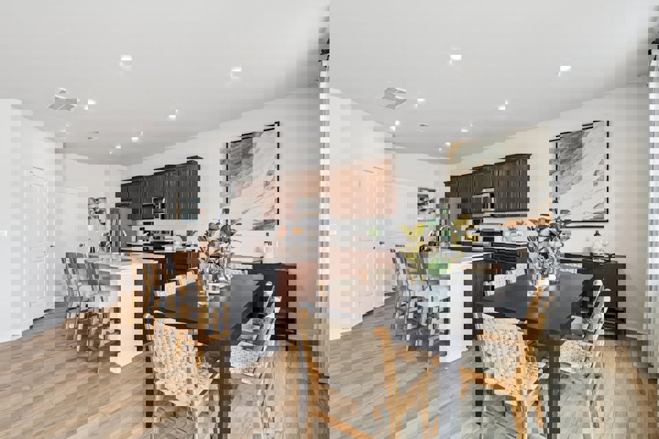 A kitchen with a dining table.