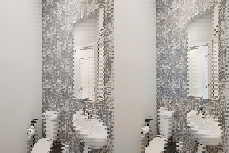 A bathroom with a sink and toilet.