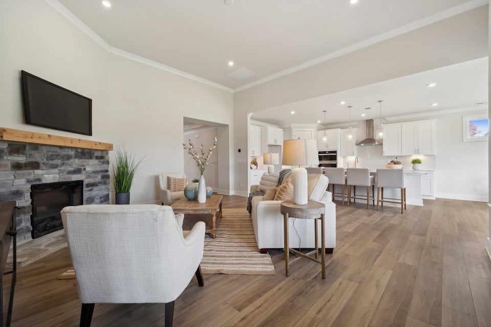 A large living room with a fireplace.