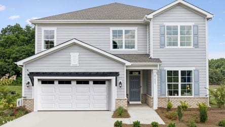A white house with a garage.