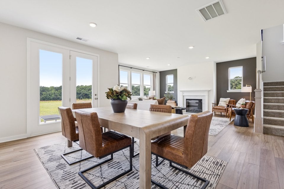 A dining room with a large table.