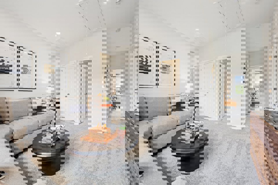 A living room with a couch and a coffee table.