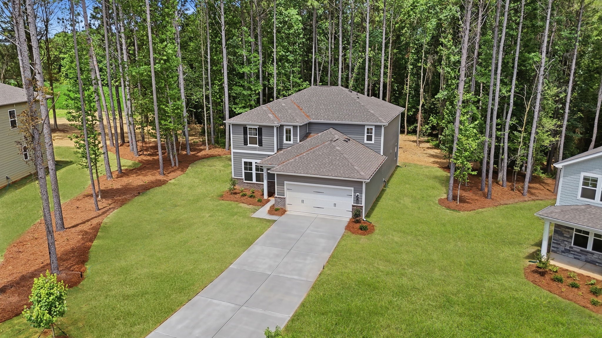 A house with a grass yard.