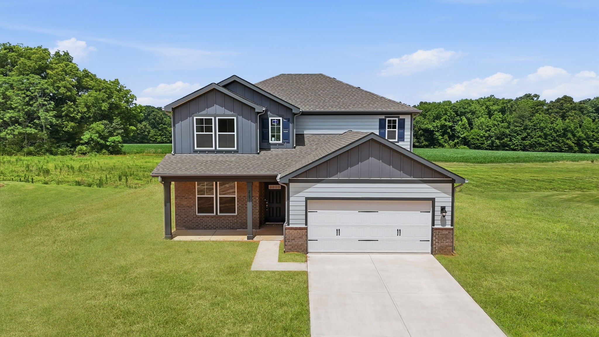 A house with a grass yard.