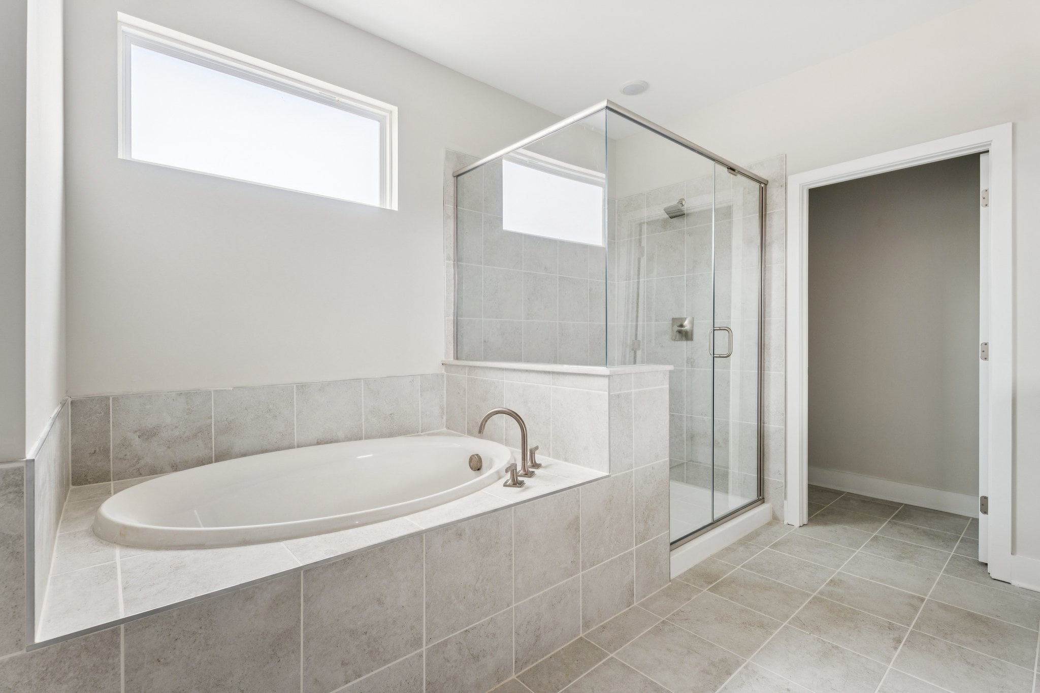 A bathroom with a tub and sink.