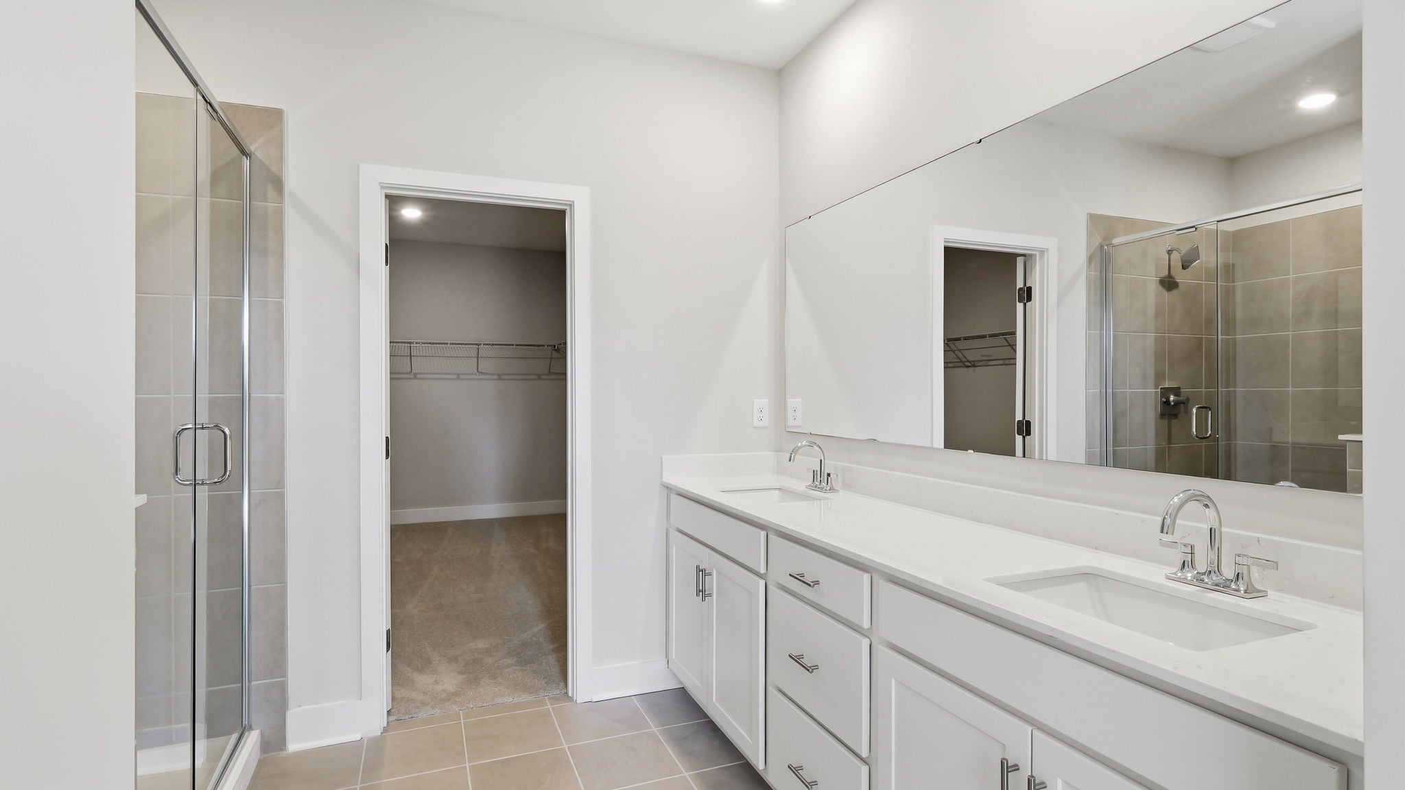 A bathroom with a glass shower.
