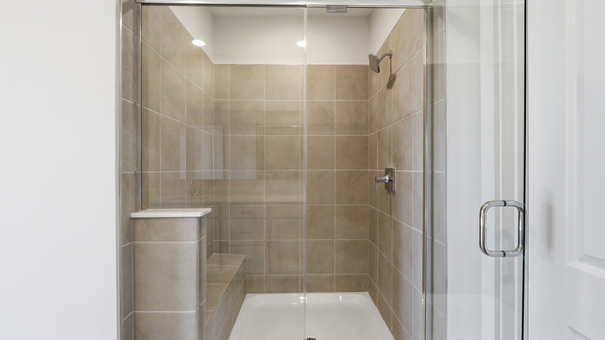 A bathroom with a glass shower.