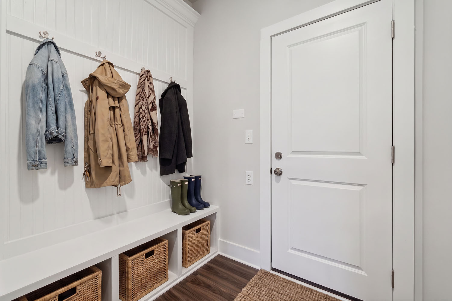 A bathroom with a white door and a white door.