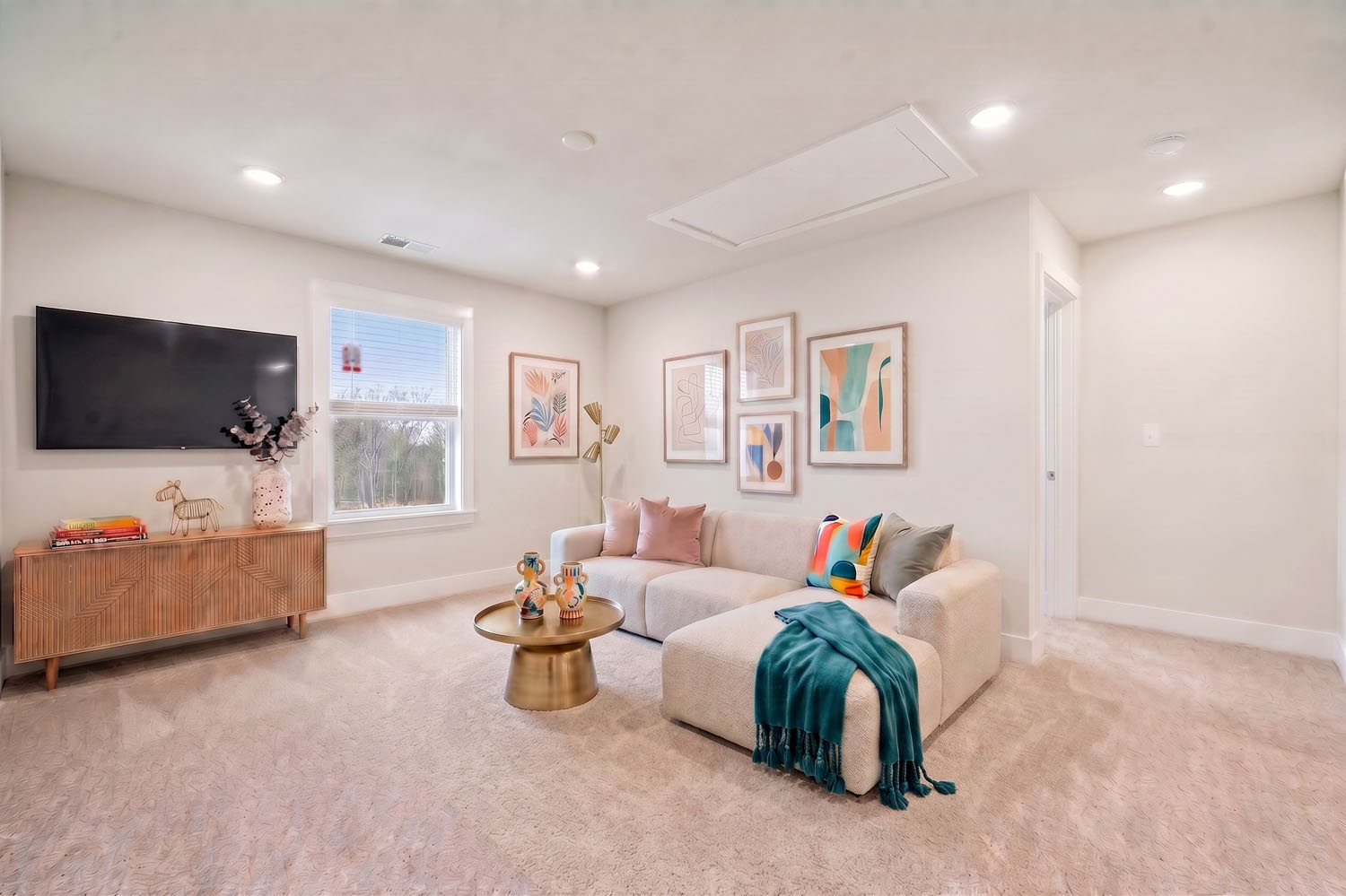 A living room with a couch and a tv.