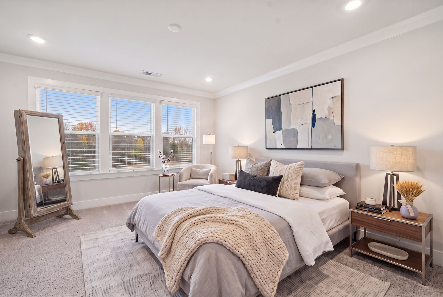 A bedroom with a large bed.