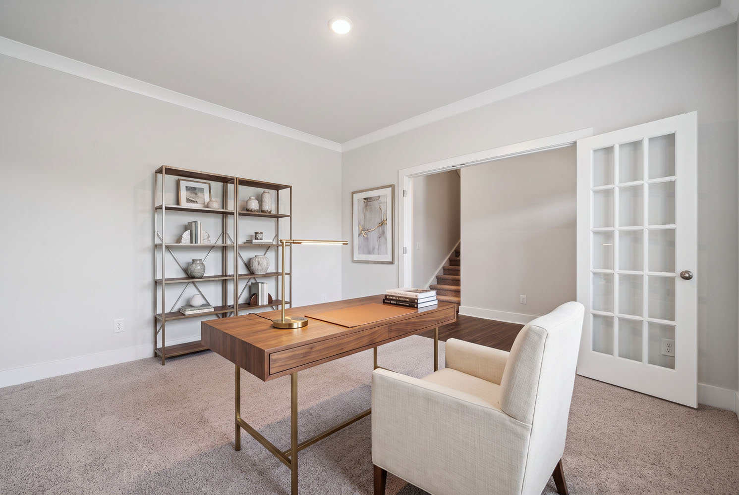 A room with a table and chairs.