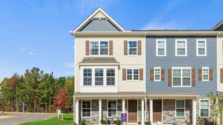A large building with trees in the front.