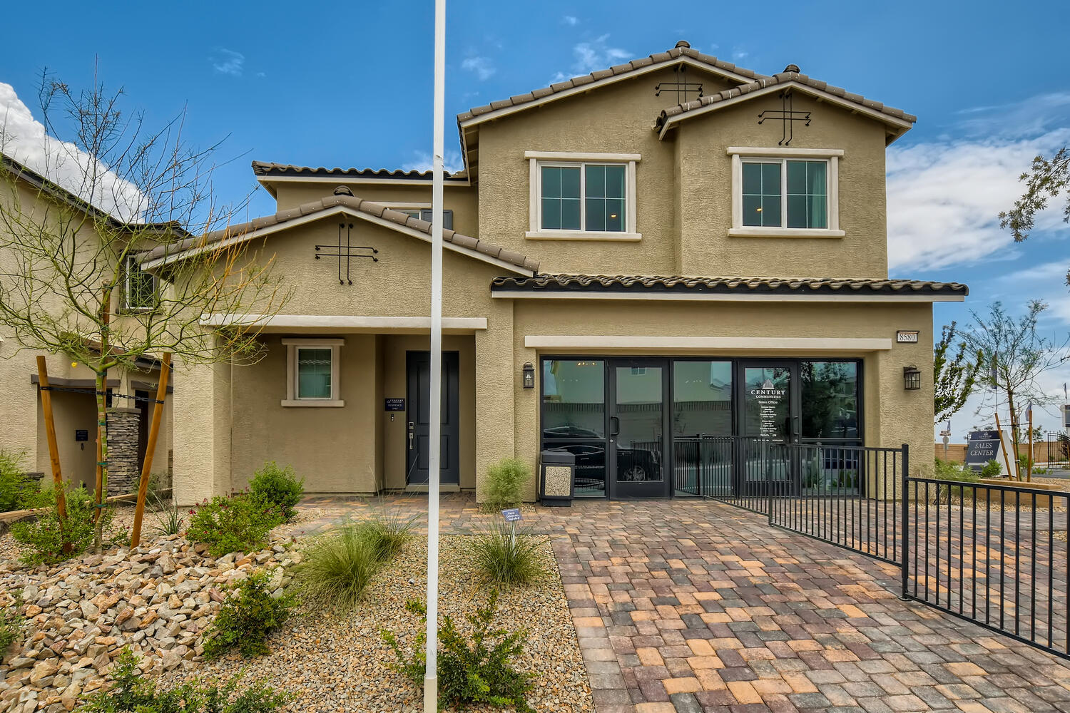 A house with a brick driveway.